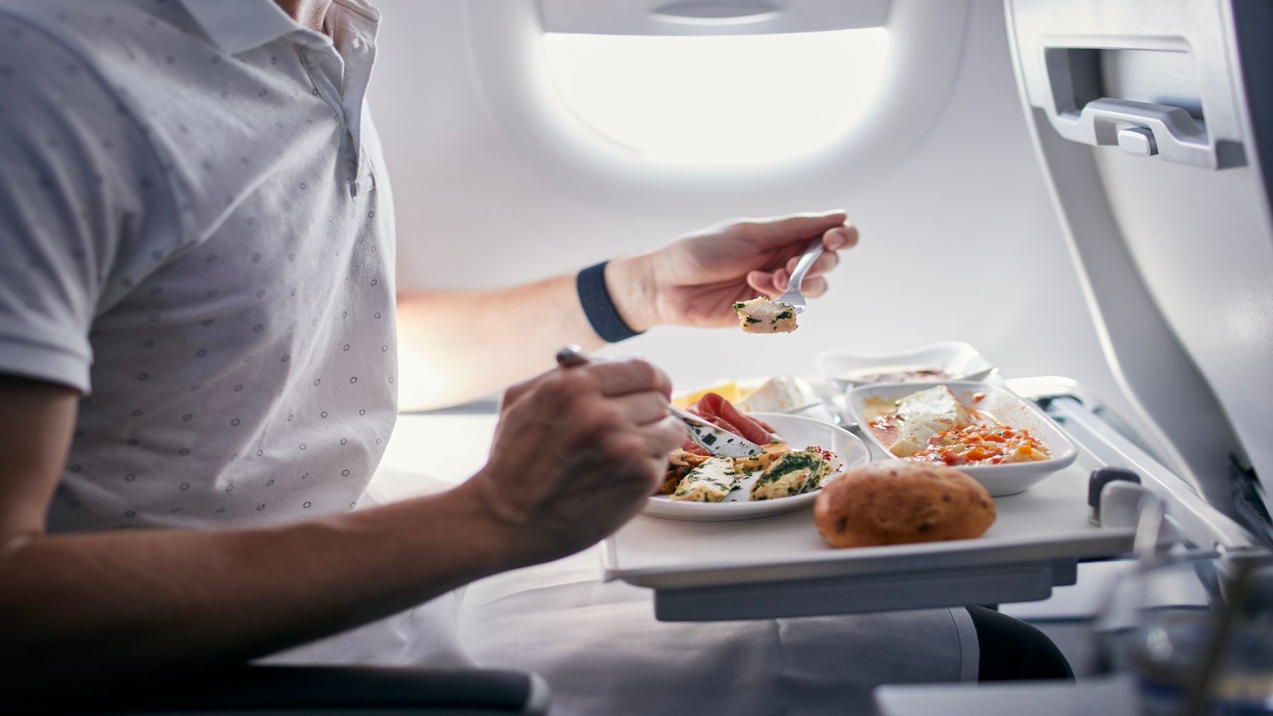 Confirmed—The mistake everyone makes when eating on the plane that prevents a good night&#039;s sleep, according to a Level flight attendant